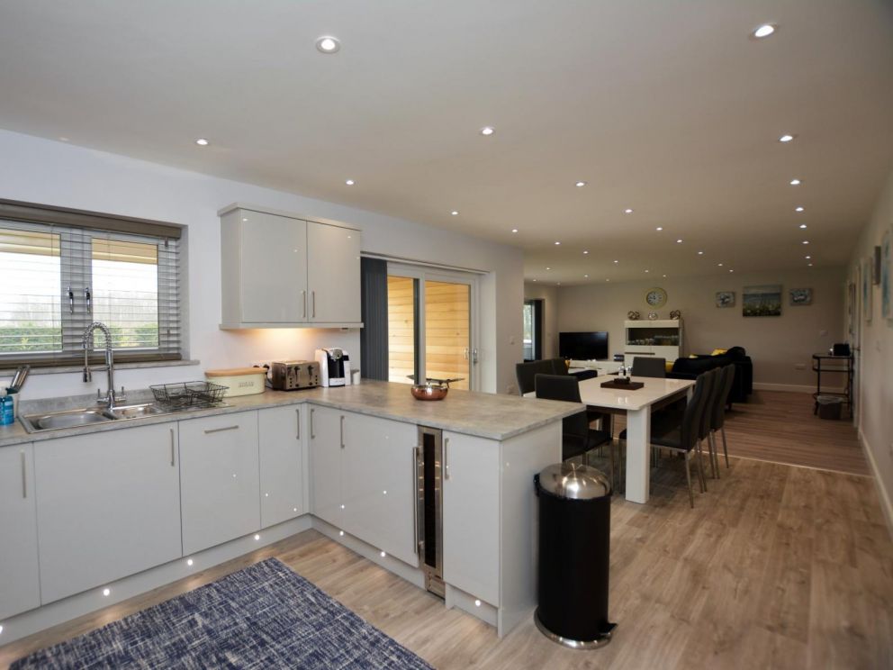 Crest Country Retreats in Oswestry - lodges for rent. Spacious open plan living area, with natural light flooding in through the patio doors