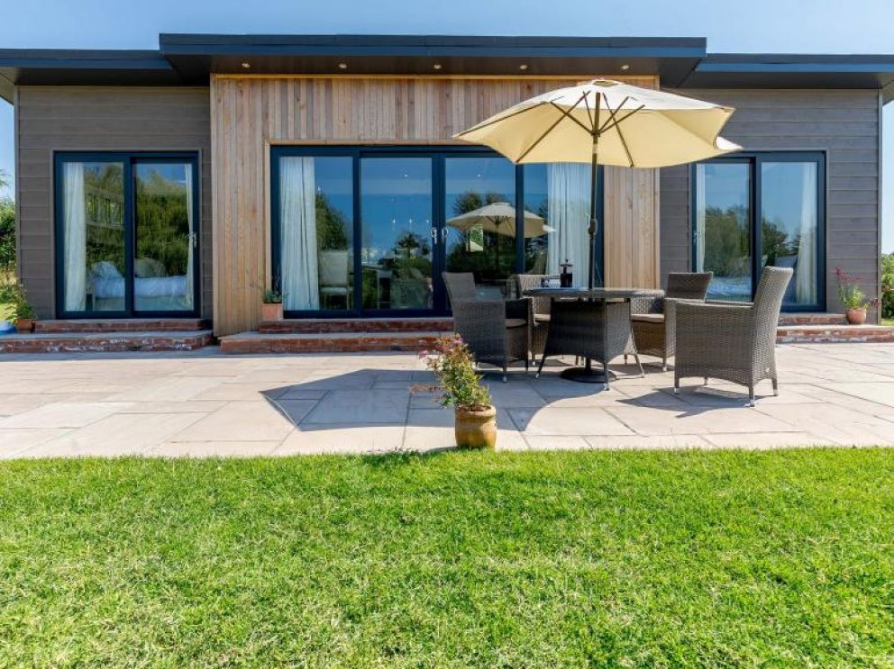 Ludlow Fishing Lodges in Ashford Bowdler for rent with wood burner and views across the fishing pool