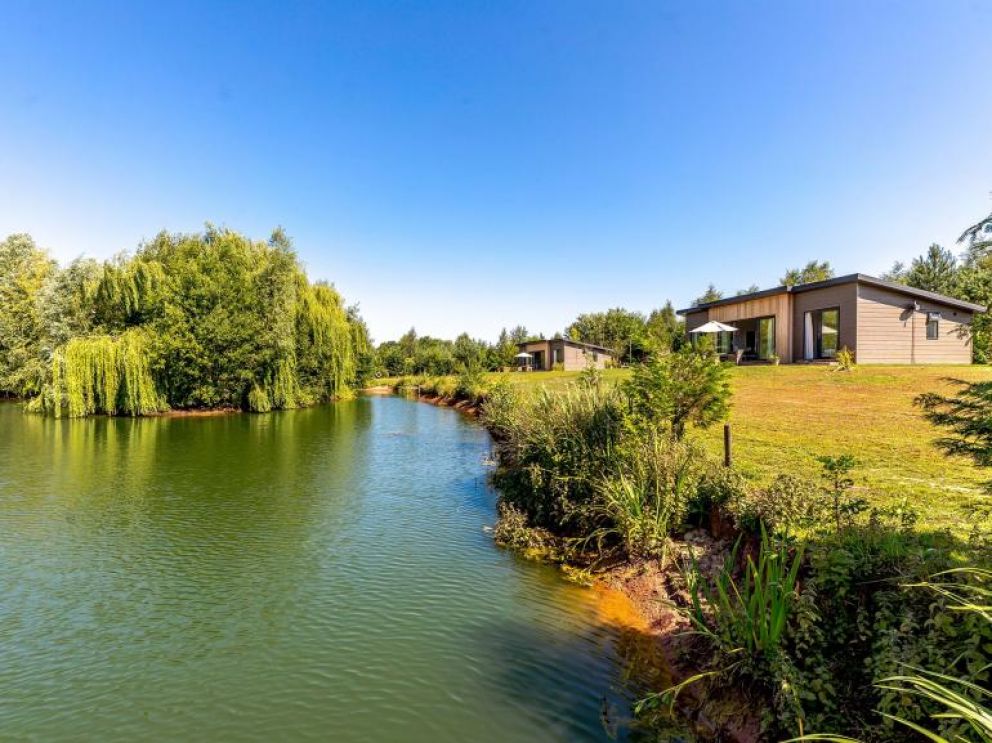 Ludlow Fishing Lodges in Ashford Bowdler for rent with wood burner and views across the fishing pool