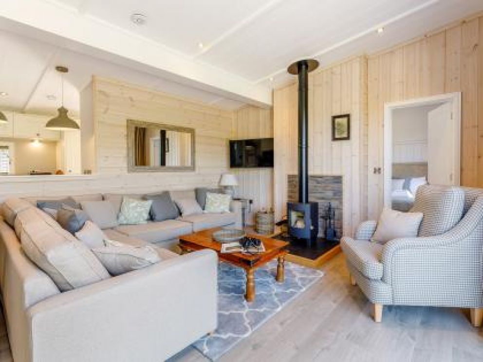 Ludlow Fishing Lodges in Ashford Bowdler for rent with wood burner and views across the fishing pool