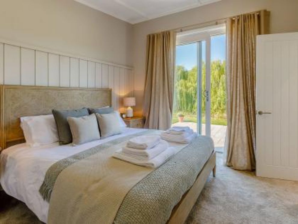 Ludlow Fishing Lodges in Ashford Bowdler for rent with wood burner and views across the fishing pool