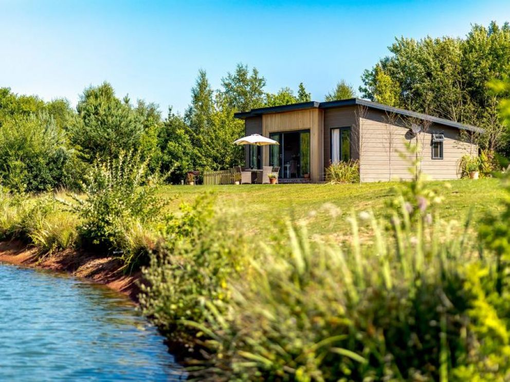 Ludlow Fishing Lodges in Ashford Bowdler for rent with wood burner and views across the fishing pool