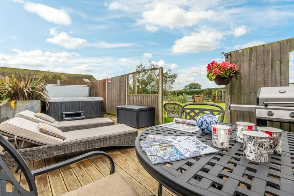 Cartshed Lodge, Hoveton in the heartland of the Norfolk Broads - adult only lodge for rent with hot tub, sun loungers and barbecue