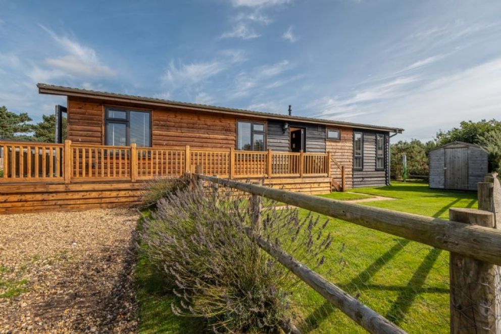 Suffolk Barn, Kelling, Norfolk - pet friendly, lodge for rent on Kelling Heath Holiday Park with outdoor pool and Fitness Centre. Close to the beach
