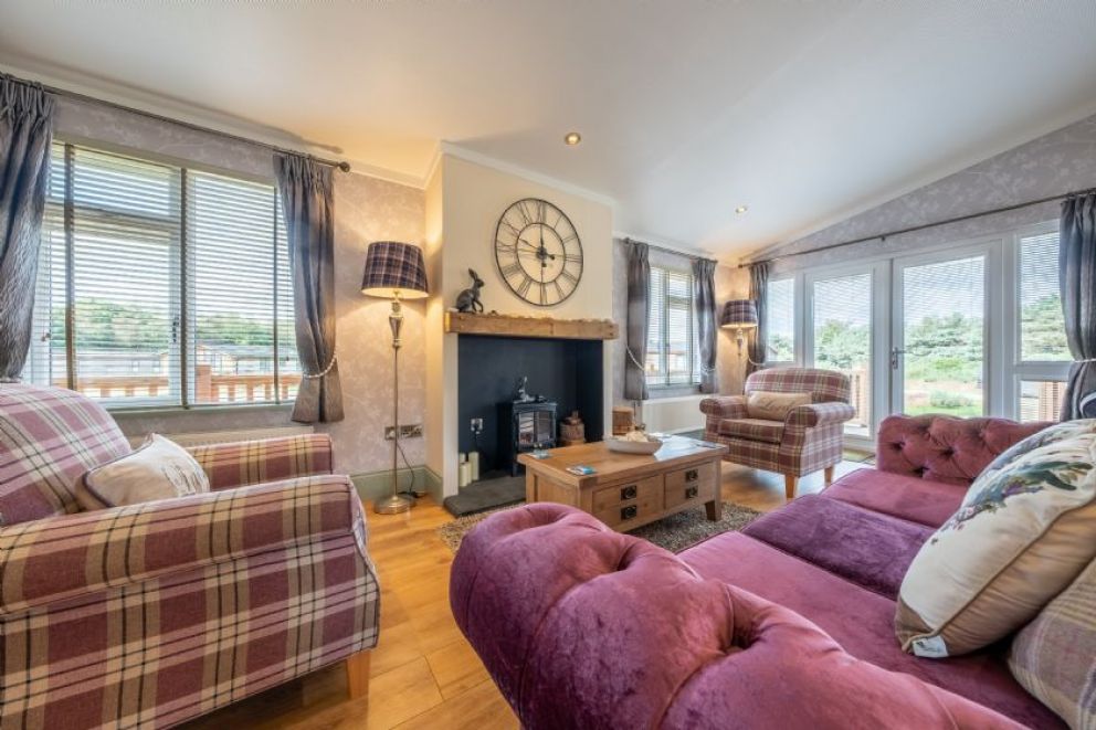 Suffolk Barn, Kelling, Norfolk - pet friendly, lodge for rent on Kelling Heath Holiday Park with outdoor pool and Fitness Centre. Close to the beach