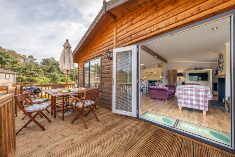 Suffolk Barn, Kelling, Norfolk - pet friendly, lodge for rent on Kelling Heath Holiday Park with outdoor pool and Fitness Centre. Close to the beach