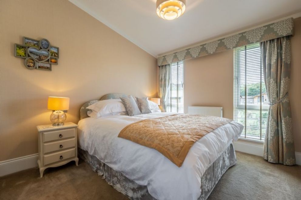 Suffolk Barn, Kelling, Norfolk - pet friendly, lodge for rent on Kelling Heath Holiday Park with outdoor pool and Fitness Centre. Close to the beach