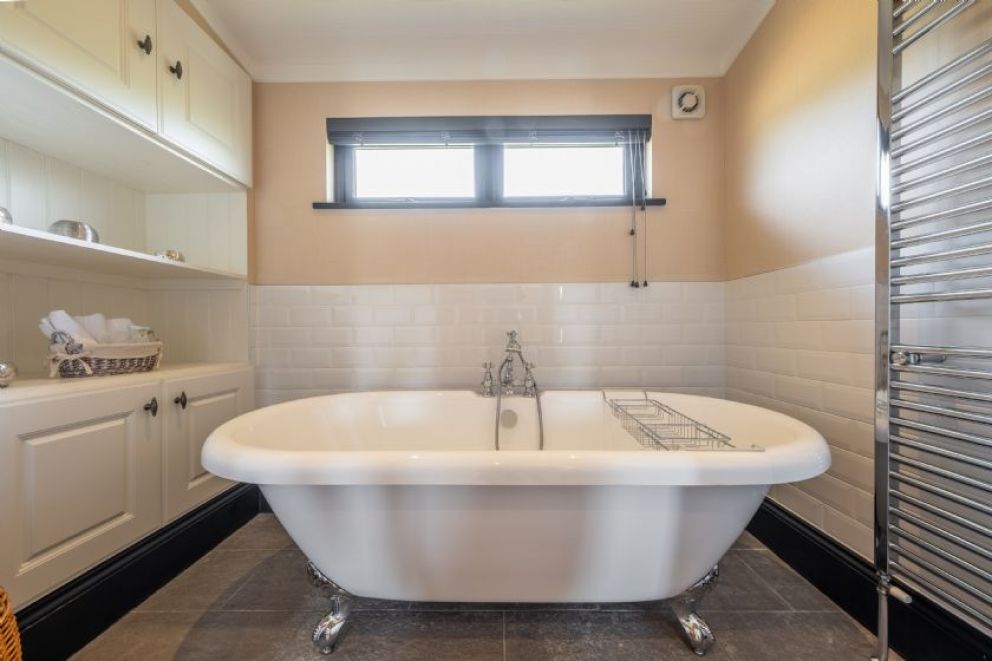 Suffolk Barn, Kelling, Norfolk - pet friendly, lodge for rent on Kelling Heath Holiday Park with outdoor pool and Fitness Centre. Close to the beach