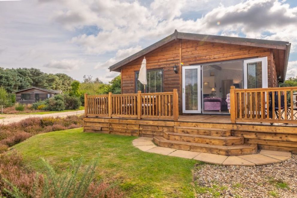 Suffolk Barn, Kelling, Norfolk - pet friendly, lodge for rent on Kelling Heath Holiday Park with outdoor pool and Fitness Centre. Close to the beach