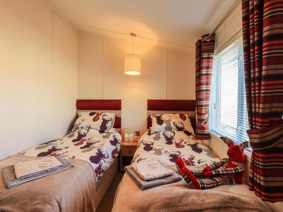 Finchwood Lodge in High Hesket, Cumbria - for rent with hot tub and enclosed decking