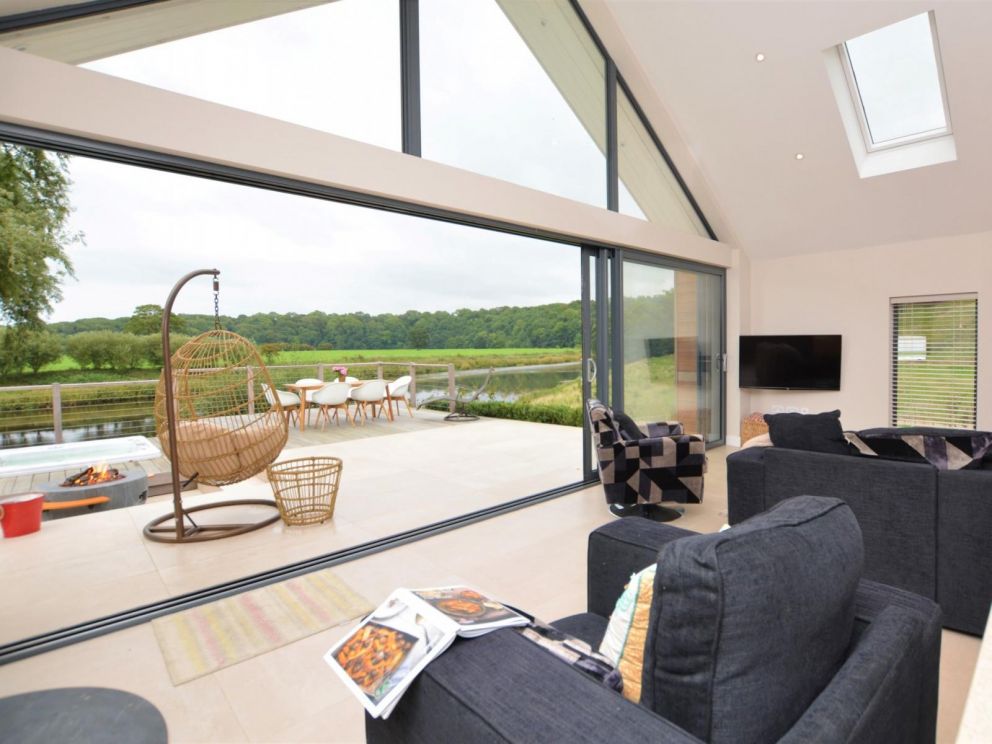 Riverside Fishing Lodge in Balderstone for rent with hot tub, fire pit and woodburner