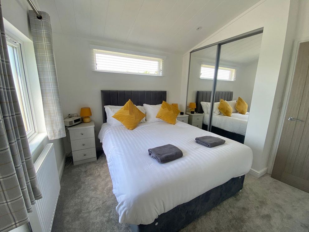 The Lake House master bedroom at Docker Holiday Park 