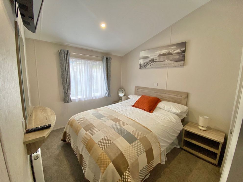 The Lodge master bedroom at Docker Holiday Park 