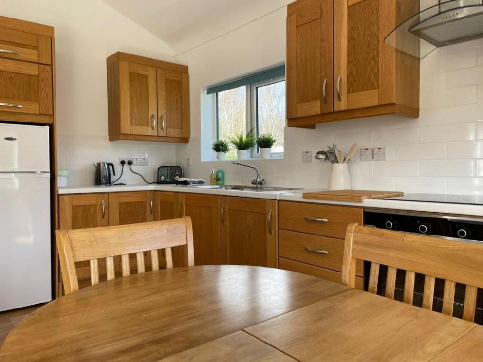 Lisnaskea Pine Lodge, County Fermanagh - pet friendly, holiday lodge with hot tub and wood burning stove. Located at Upper Lough Erne with water activities and private marina