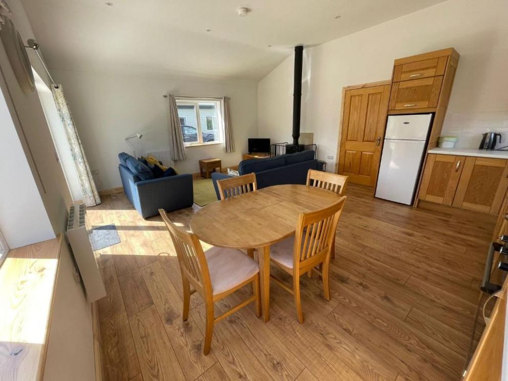 Lisnaskea Pine Lodge, County Fermanagh - pet friendly, holiday lodge with hot tub and wood burning stove. Located at Upper Lough Erne with water activities and private marina