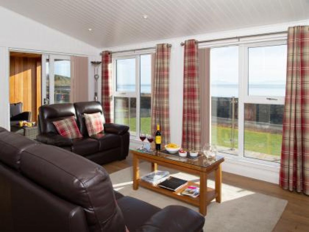 Romantic Hot Tub Lodges at Rascarrel Bay - pet friendly lodges for rent, with hot tub on the sea shore