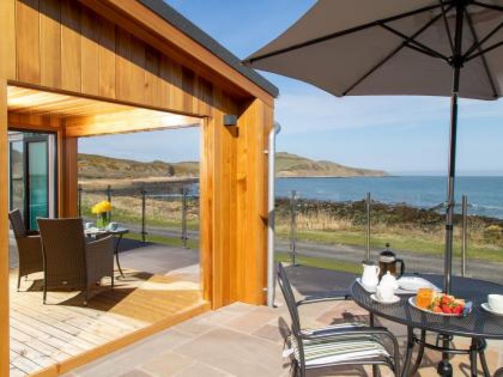 Romantic Hot Tub Lodges at Rascarrel Bay - pet friendly lodges for rent, with hot tub on the sea shore