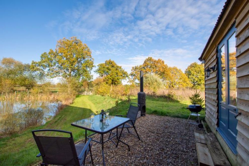 Plush Huts, Biddenden, East Sussex - pet friendly, lakeside holiday lodge, with enclosed garden, hot tub and wildlife cameras