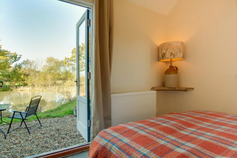 Plush Huts, Biddenden, East Sussex - pet friendly, lakeside holiday lodge, with enclosed garden, hot tub and wildlife cameras