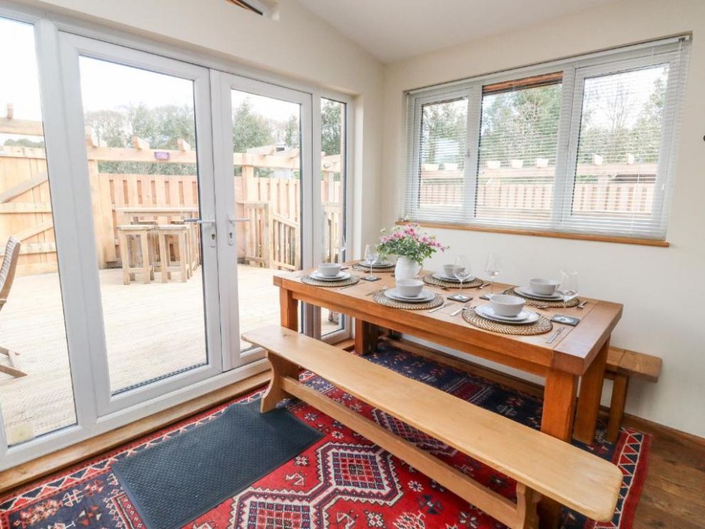 Gloccamaura, Newton Abbot, Devon - pet friendly holiday lodge, with hot tub, wood burning stove and enclosed garden