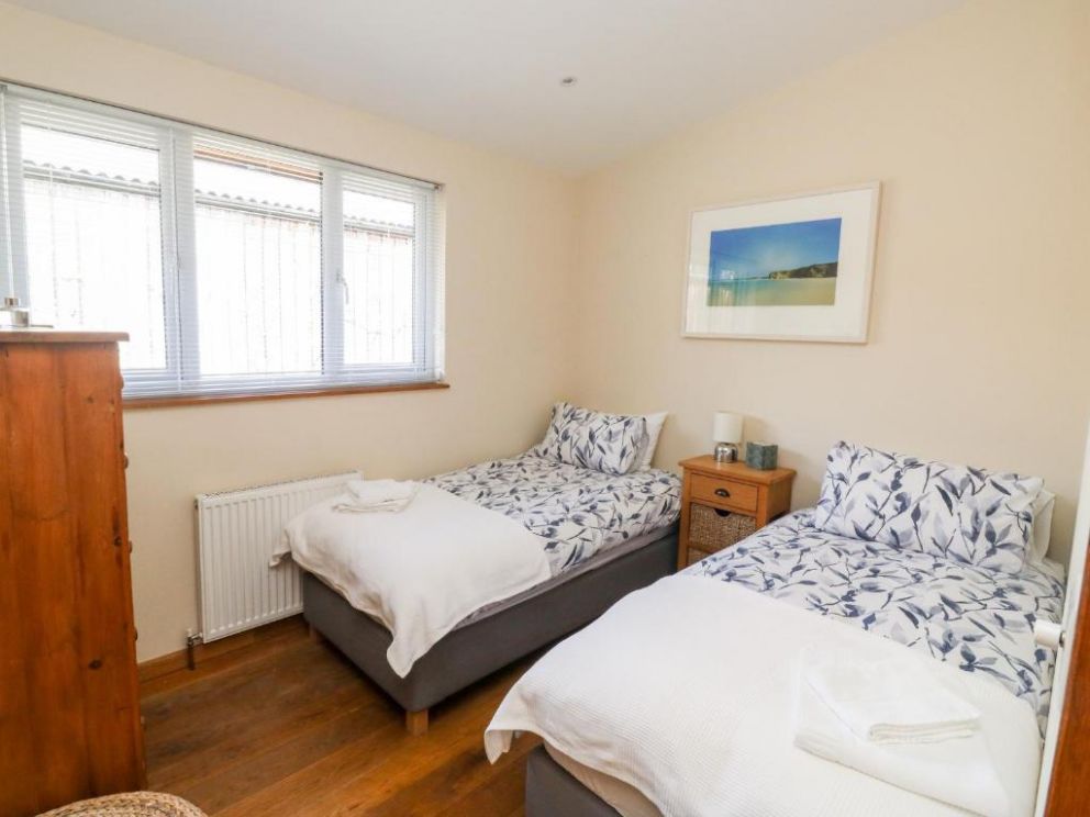 Gloccamaura, Newton Abbot, Devon - pet friendly holiday lodge, with hot tub, wood burning stove and enclosed garden