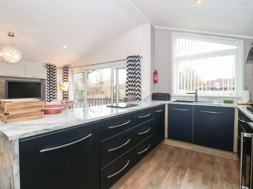 Owls Nest, Furzehill, Dorset - pet friendly, lodge on holiday park with outdoor pool, children's pool, volleyball, basketball & tennis courts, adventure playground, table tennis and dog paddock