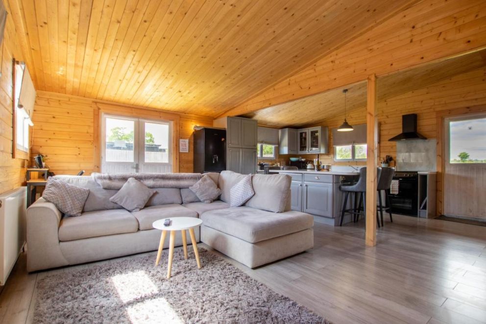 Rural Log Cabin in Slindon - pet friendly accommodation, with hot tub and fishing lake