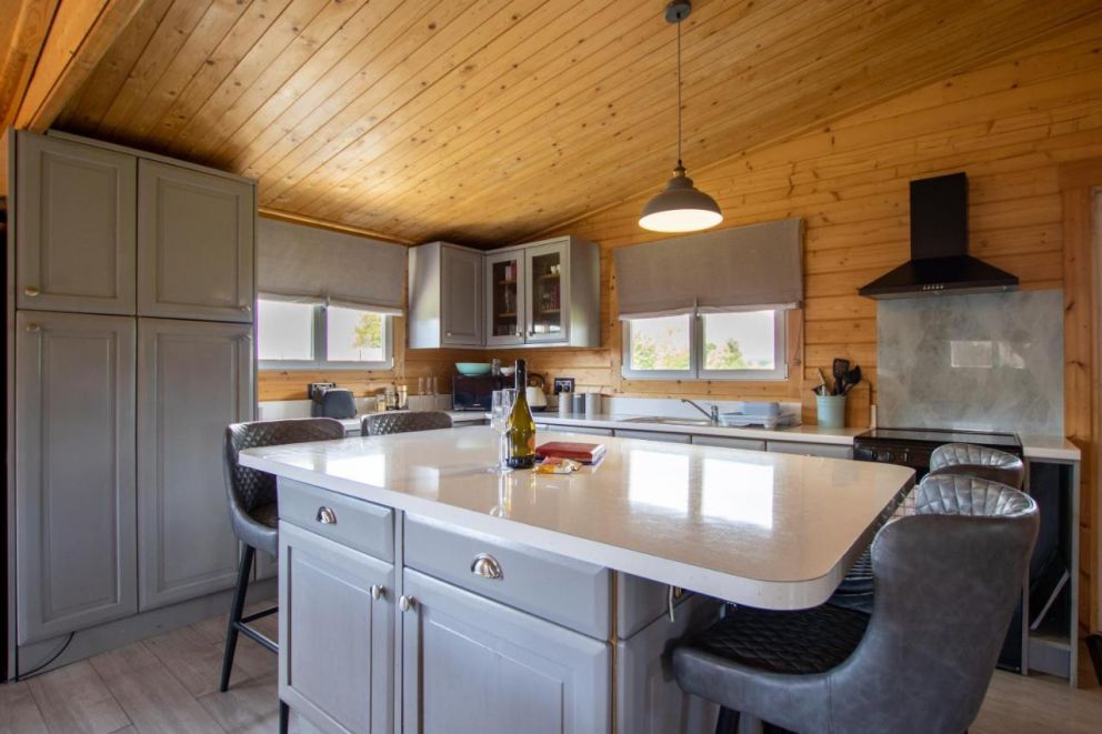 Rural Log Cabin in Slindon - pet friendly accommodation, with hot tub and fishing lake