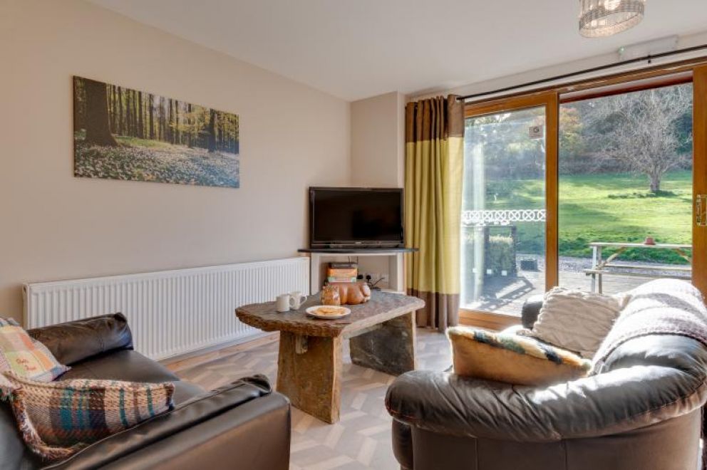 MotoCamp Wales - pet friendly lodge for rent in countryside location with woodland walks