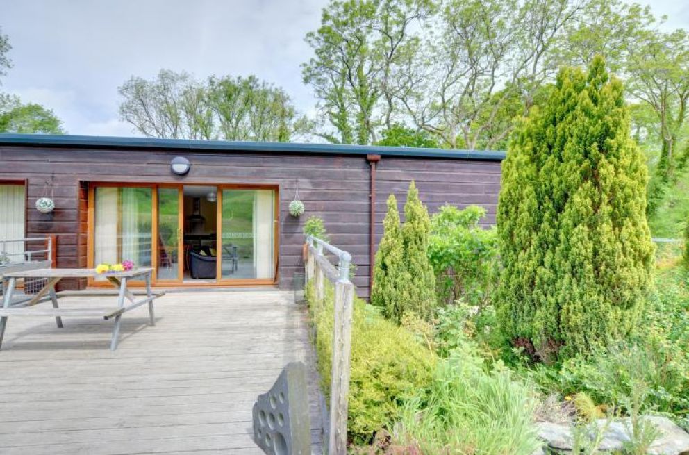 MotoCamp Wales - pet friendly lodge for rent in countryside location with woodland walks