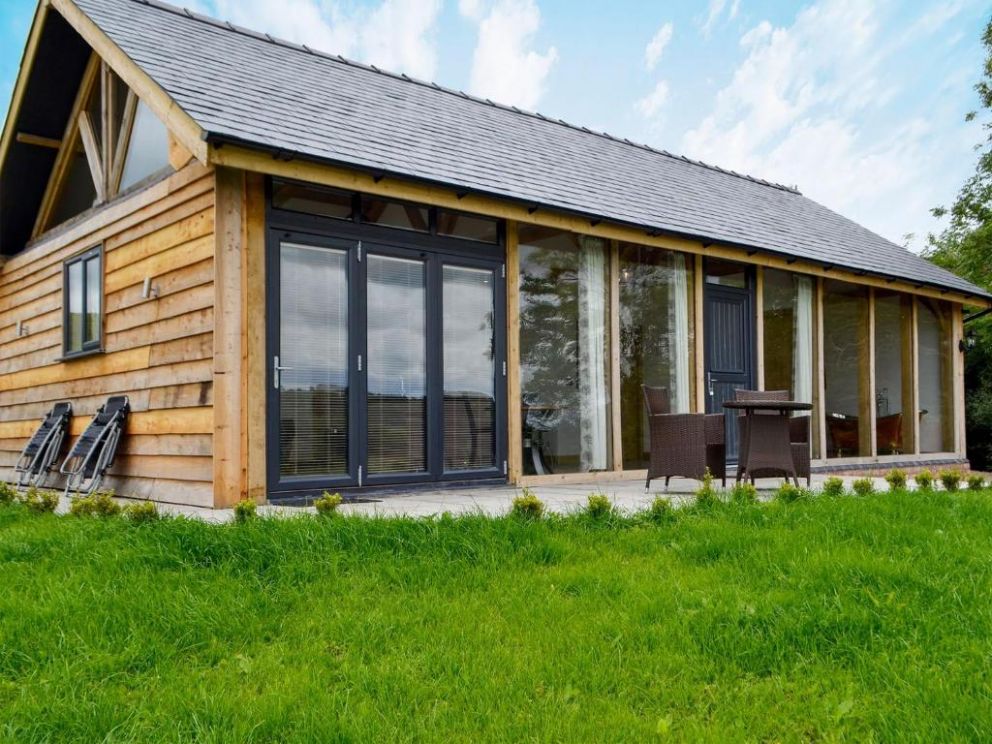 Oak View, Highgate, Powys - pet friendly holiday lodge with hot tub