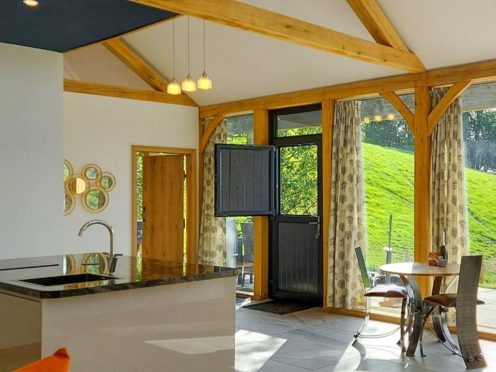 The Hideaway, Highgate, Powys - pet friendly holiday lodge with hot tub