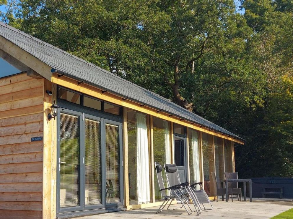 The Hideaway, Highgate, Powys - pet friendly holiday lodge with hot tub