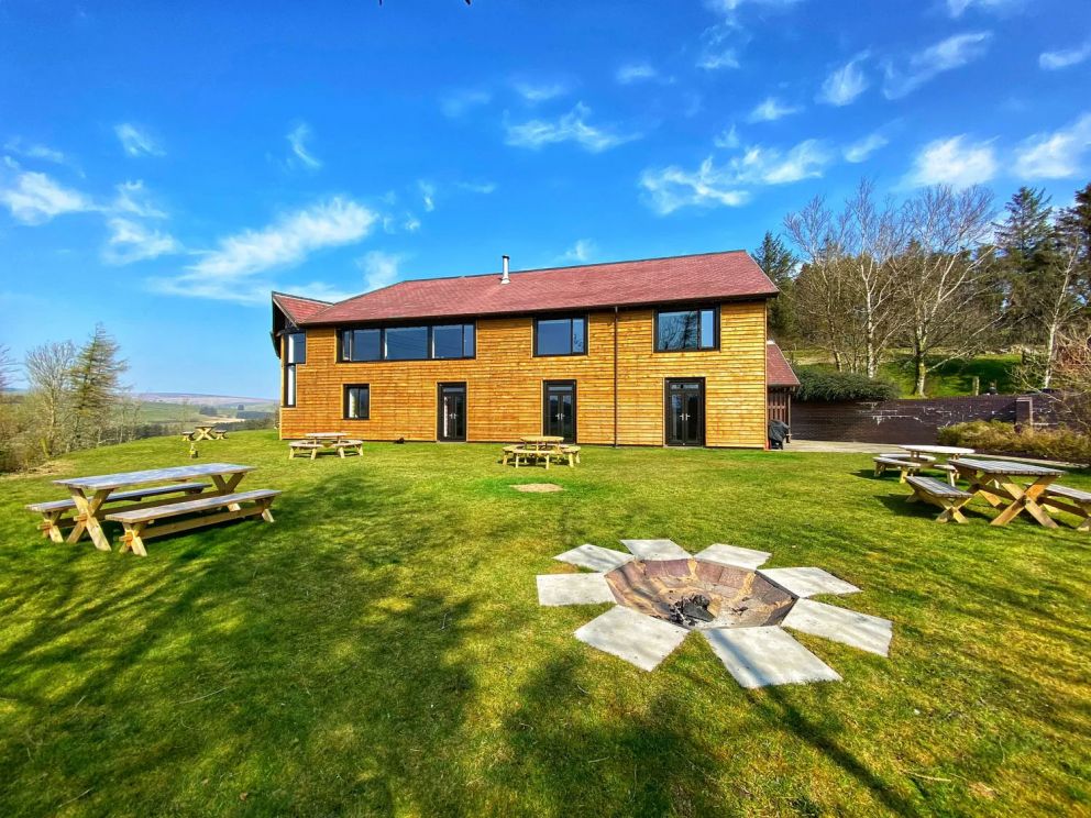 The Lodge in Staylittle in Powys - sleeps 40 guests, pet friendly, with activity room, table tennis, table football, fire pit and wood burning stove