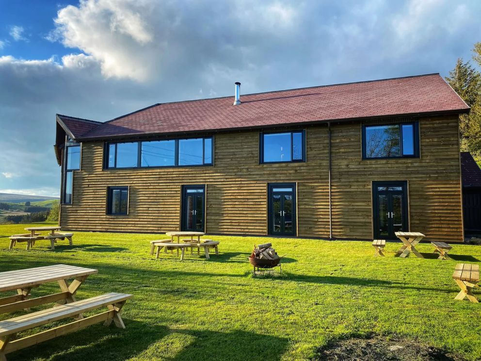 The Lodge in Staylittle in Powys - sleeps 40 guests, pet friendly, with activity room, table tennis, table football, fire pit and wood burning stove