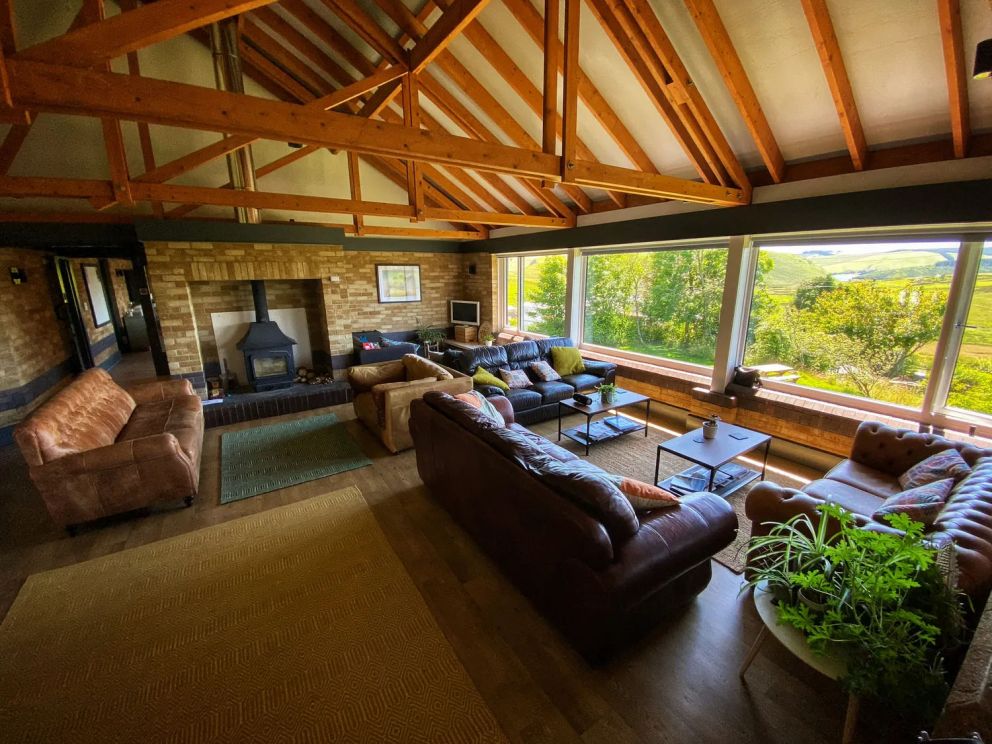 The Lodge in Staylittle in Powys - sleeps 40 guests, pet friendly, with activity room, table tennis, table football, fire pit and wood burning stove