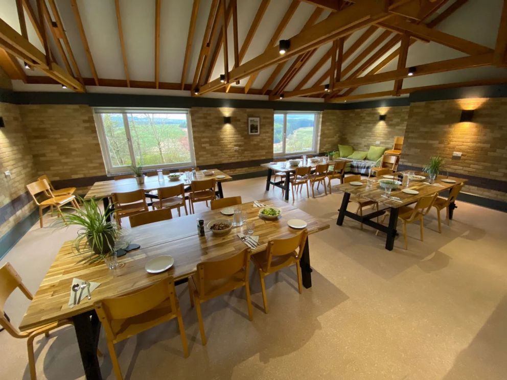 The Lodge in Staylittle in Powys - sleeps 40 guests, pet friendly, with activity room, table tennis, table football, fire pit and wood burning stove