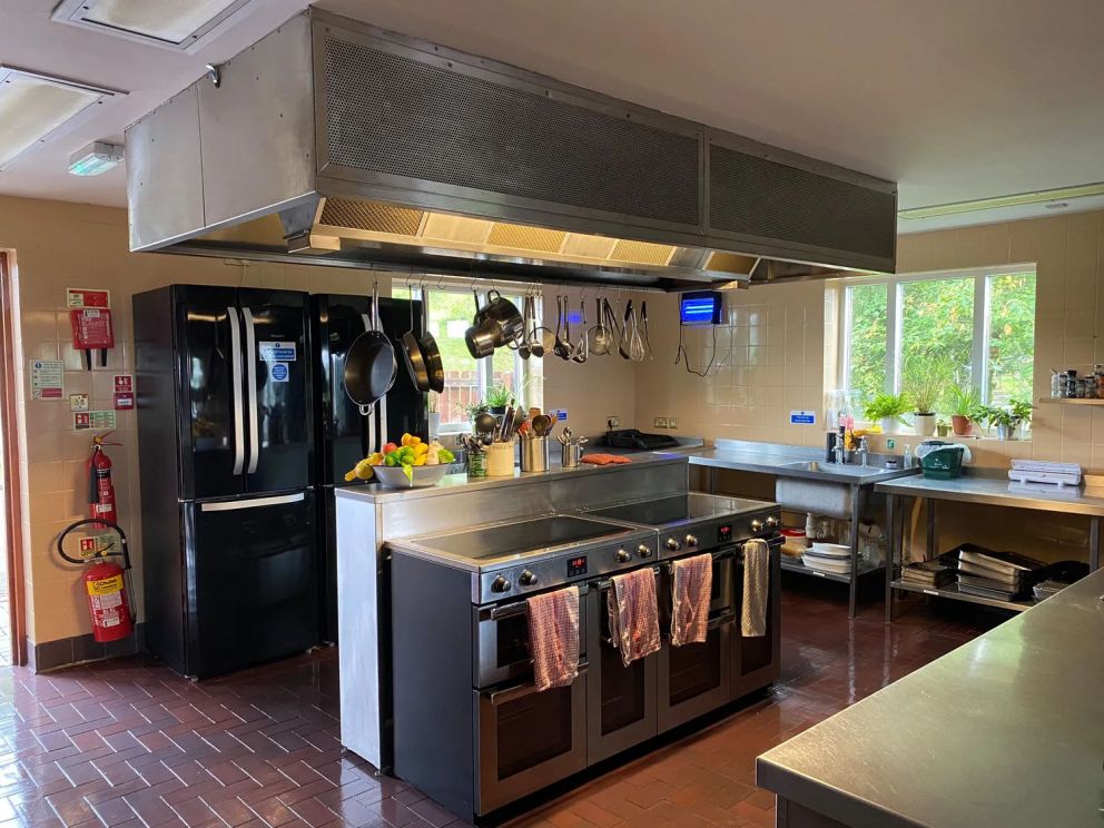 The Lodge in Staylittle in Powys - sleeps 40 guests, pet friendly, with activity room, table tennis, table football, fire pit and wood burning stove